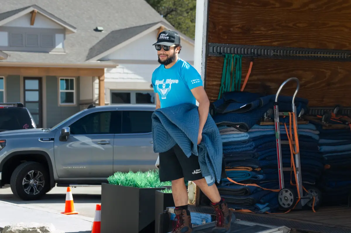 Family working with movers during relocation