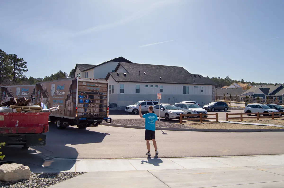 Mover guiding a truck backing up safely