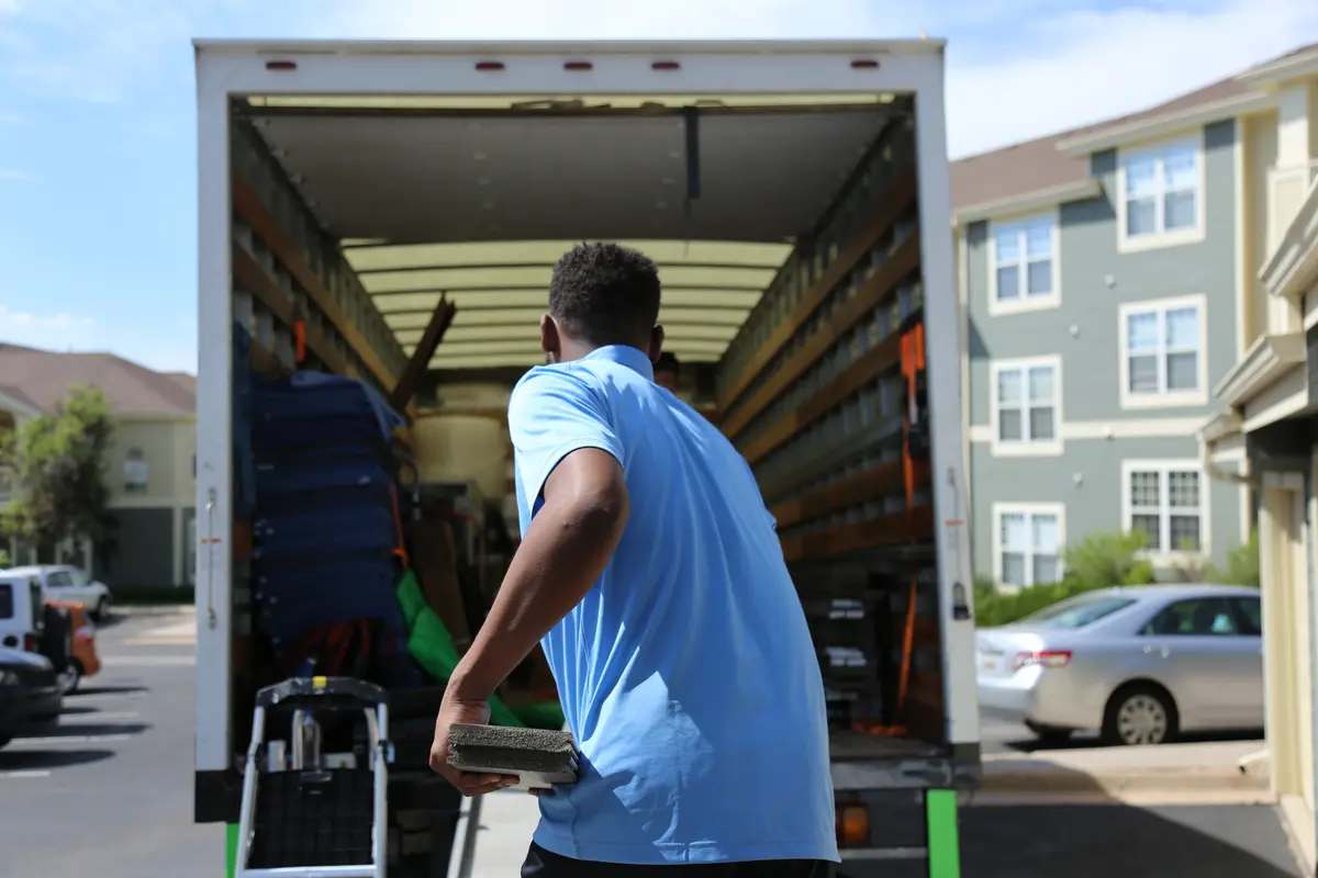 Mover actively loading a truck during summer