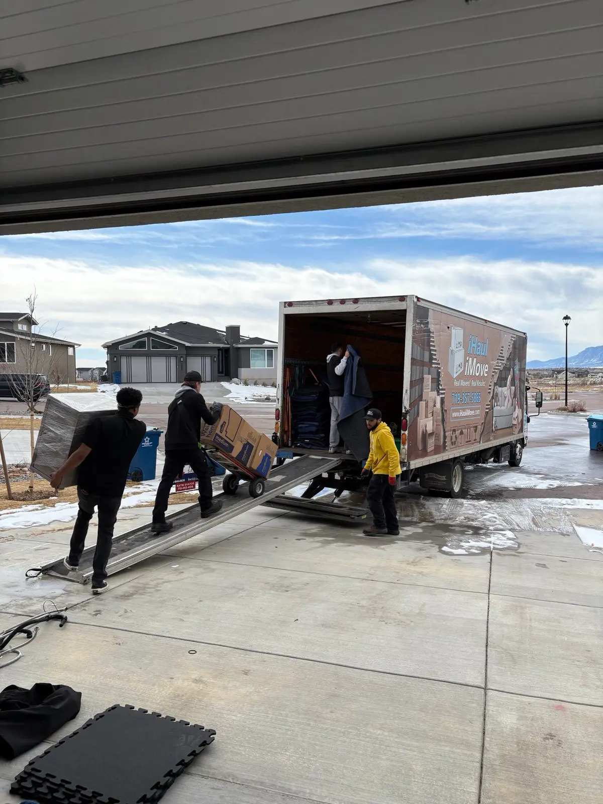 iHaul iMove crew loading moving truck in Colorado winter
