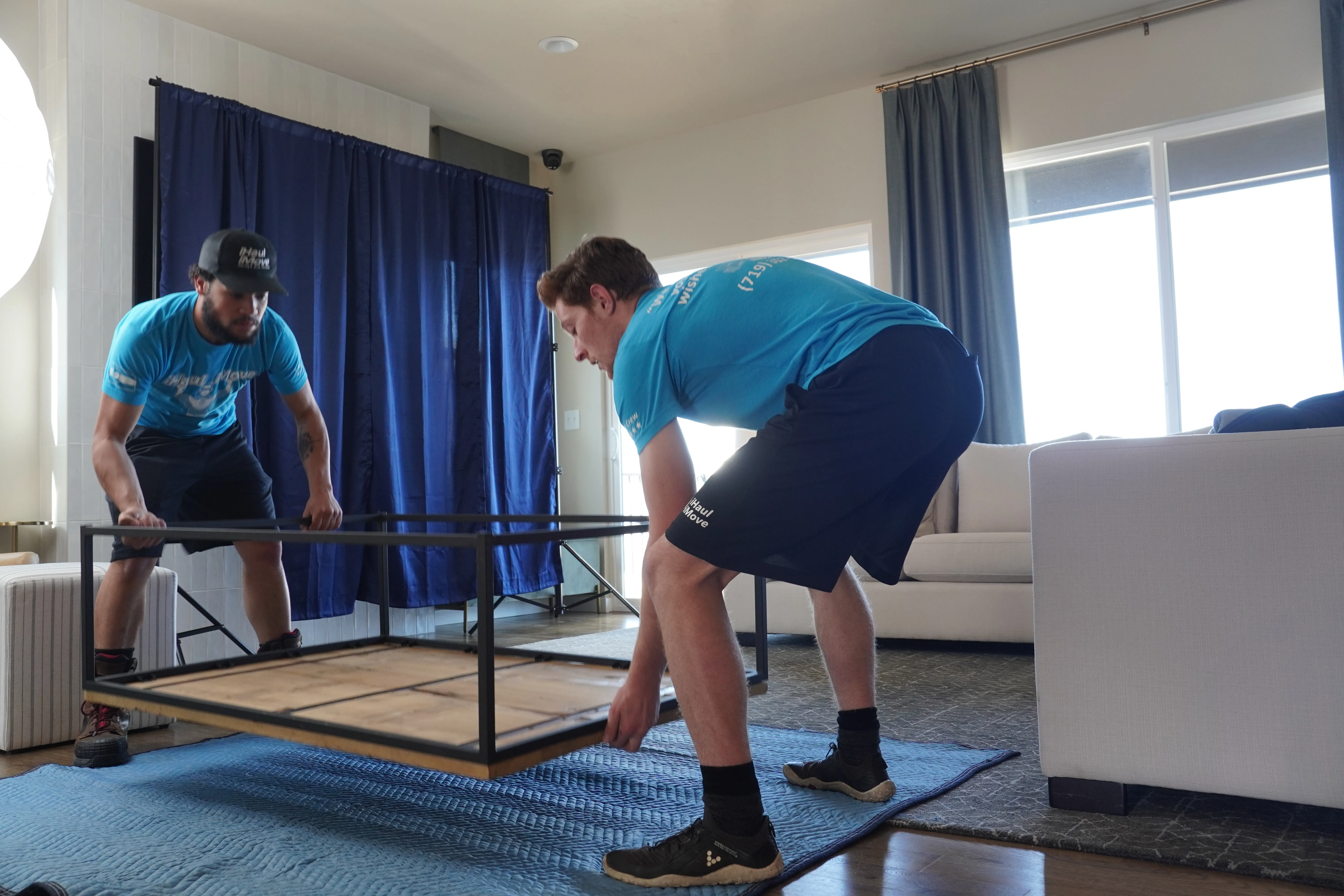 Professional packing crew carefully wrapping items